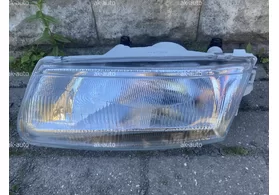 Фара передняя левая Mitsubishi Carisma дорестайлинг 